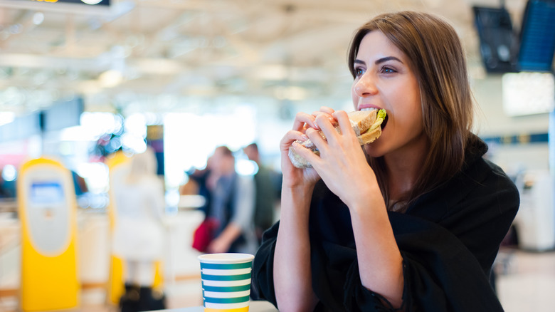 Person eating at airport