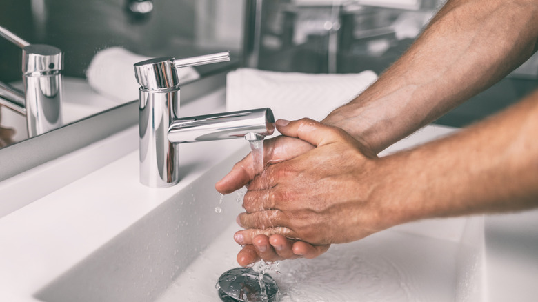 Person washing their hands