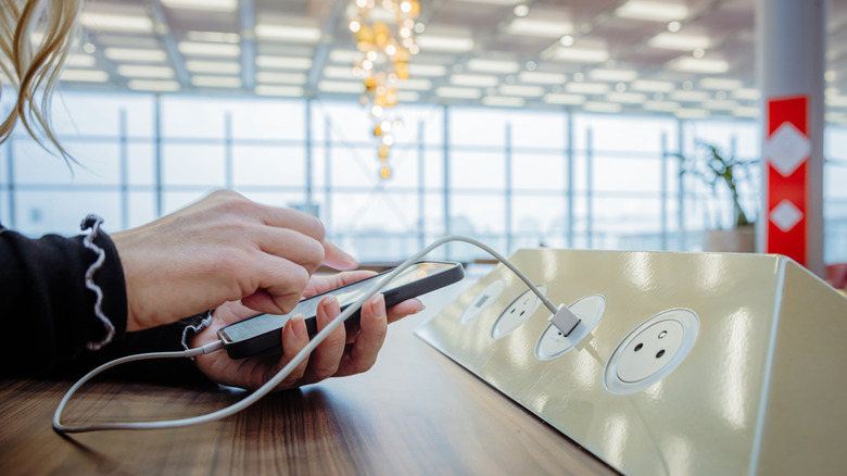 Person using outlet at airport