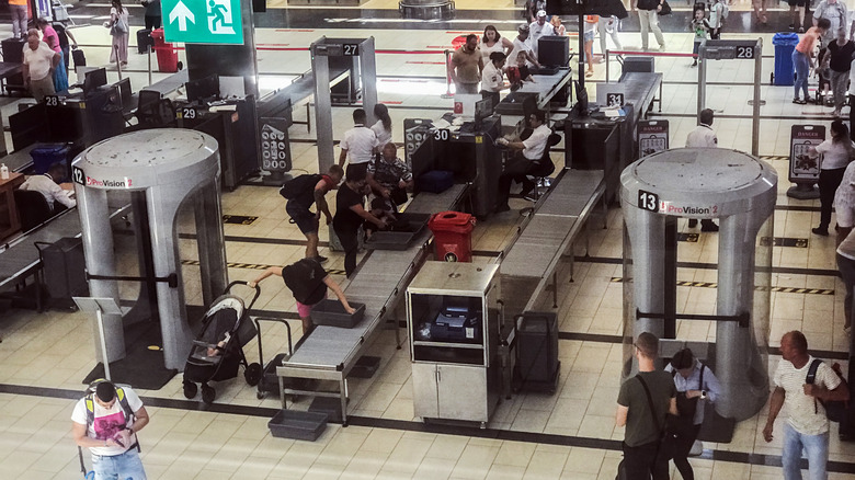 Travelers going through security at the airport