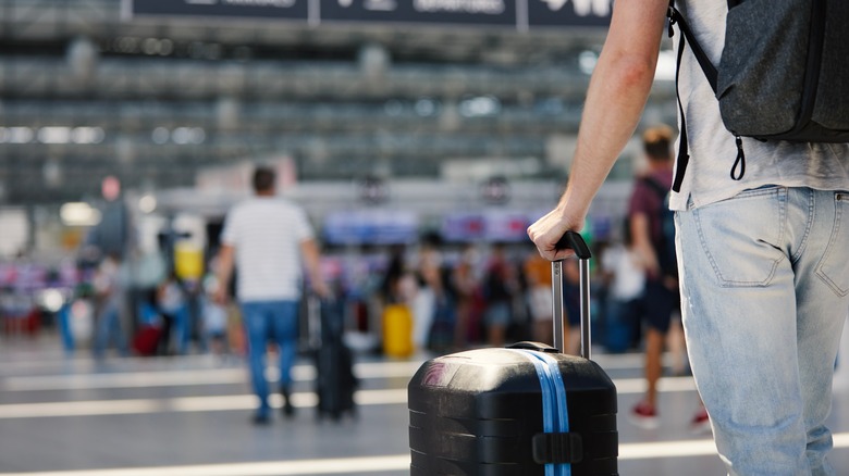 Person with suitcase in airport