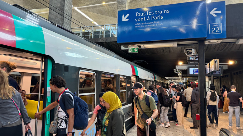 Passengers arriving at the free shuttle at Paris CDG