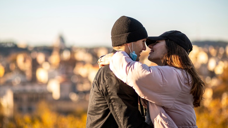 Lovers kiss on the terrace of the Orange Garden in Rome