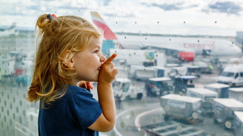 Little girl at airport window