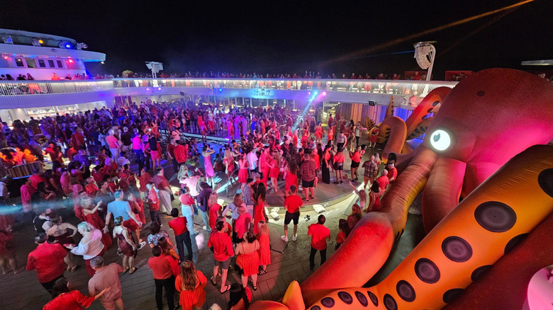 Scarlet night on Virgin Voyages' deck