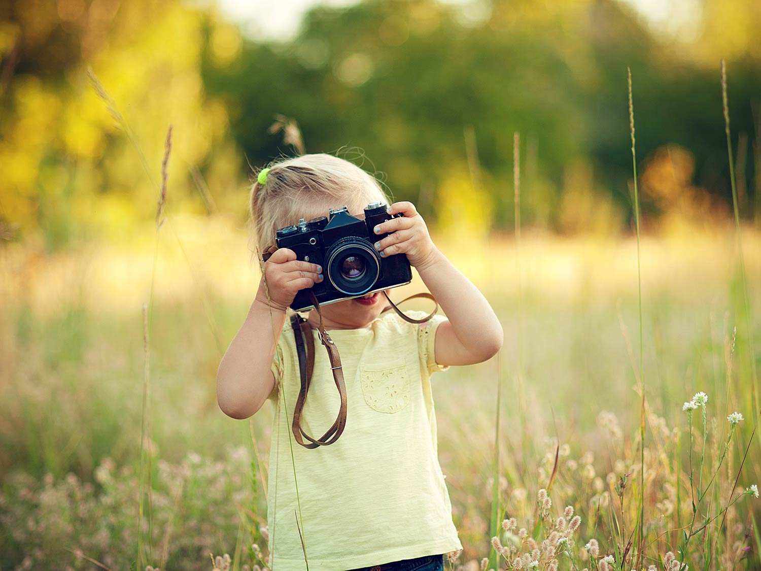 child with camera