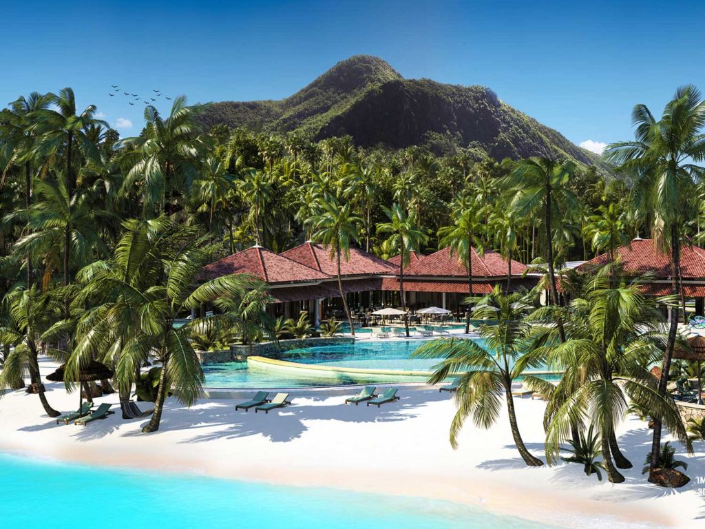 A beachside resort pool surrounded by palms.